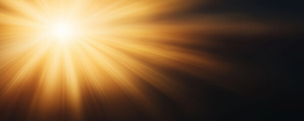 Obraz premium Golden sun rays emerging from a bright center, creating a dramatic contrast with the dark background