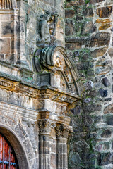 Obraz premium Image of the Cardinal Virtue of the Fortress. Detail of the north facade of the Church of the Assumption in Puertollano, Ciudad Real Province, Spain