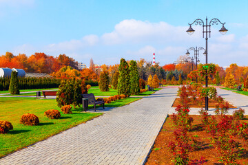 Serene park scene featuring benches under a light post. Dendrariu Park from Chisinau Moldova in...