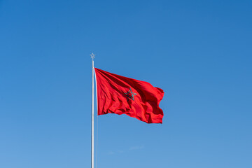 National flag of Morocco waving with a blue sky background. 
Morocco, officially the Kingdom of Morocco, is a country in the Maghreb region of North Africa.