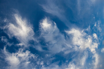 white clouds of a strange shape in the blue sky