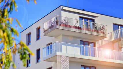 European residential architecture harmonizing with nature. Eco-friendly living in city with greens. Eco apartment building saving energy and fresh air concept. 