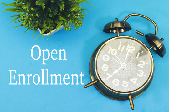 open enrollment concept with alarm clock, time to registration
