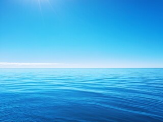 Clear blue ocean and sky under bright sunlight on a tranquil day, perfect for relaxation and contemplation at sea