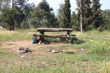 Forgotten Spaces: Picnic Table Surrounded by Litter