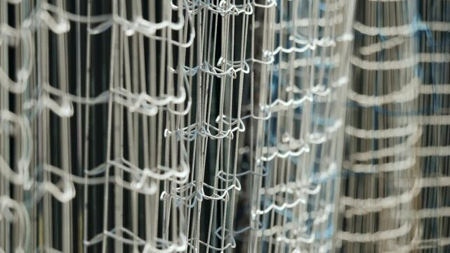 Closeup of the intricate knotted patterns of a fishing net, highlighting its craftsmanship