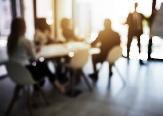 Presentation, blur and learning with business people in meeting for financial, speaker and company valuation. Investment report, asset management and budget portfolio with employees in office