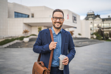 Adult man businessman go to work with thermos and briefcase