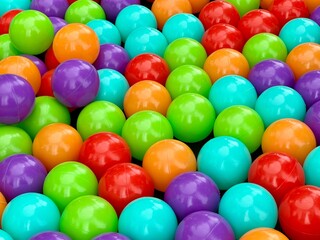 Colorful assortment of plastic balls in a vibrant play area. Pattern of balls