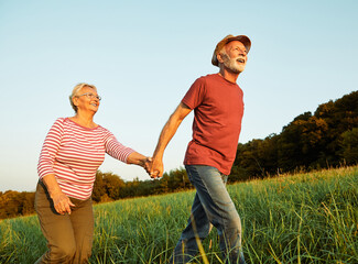 woman man outdoor senior couple happy lifestyle retirement together smiling love old nature mature...
