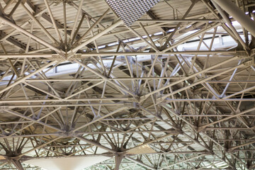 Interior of a modern airport terminal, detail of the structure of the ceiling