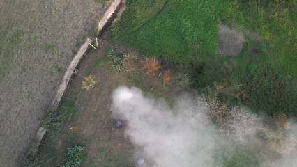 Aerial view of smoke caused by incineration. Burning agricultural waste, the easiest way to reduce or eliminate the volume of combustible materials produced by agricultural activities.