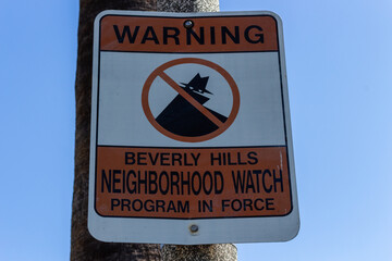 Beverly Hills Neighborhood Watch program in force sign in Los Angeles, California, USA.
