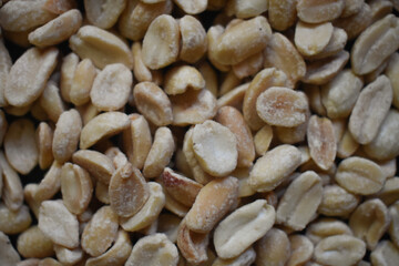 Salted roasted peanuts as background, top view. Peanut background