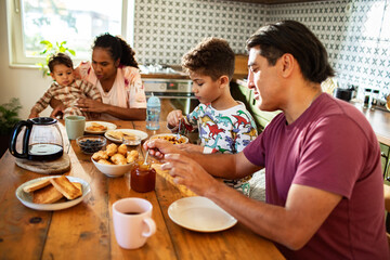 Family enjoying breakfast together at home