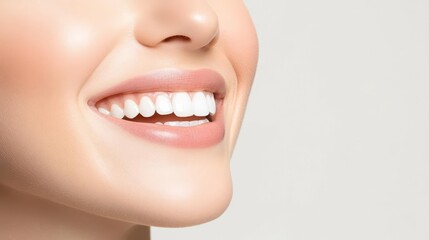 Obraz premium Close-up of a smiling mouth with bright white teeth and smooth skin.
