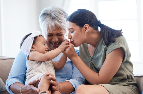 Love, relax and baby with mother and grandma in living room for playing and bonding together. Fun, kiss and infant child with mom and senior woman for generational family time on sofa in home.