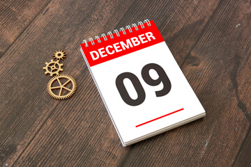 Closeup surface white wooden calendar with black 9 december word