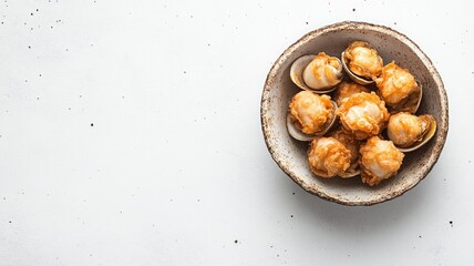 Crispy fried scallops with golden batter in ceramic bowl