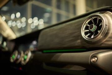 Obraz premium Closeup of car dashboard air vents near gear shift