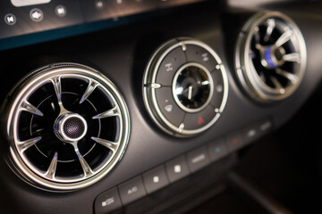 Fototapeta premium Closeup of car dashboard air vents near gear shift
