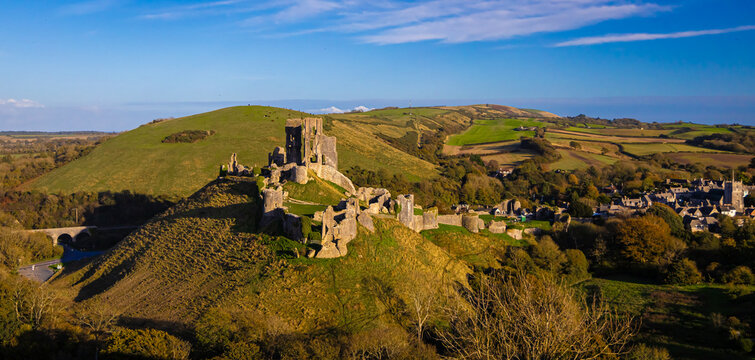 Aerial sunset view of Corfe Castle, a village and civil parish in the English county of Dorset