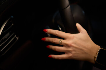 To start a car, the engine is initiated by turning a key in the ignition switch with the hand