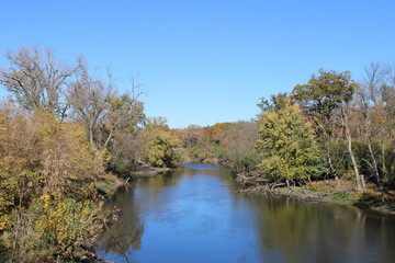 Des Plaines River in autumn with a clear sky at Camp Ground Road Woods in Des Plaines, Illinois