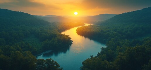 A winding river through a lush green forest at sunset.