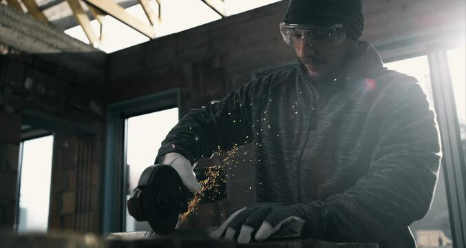 Craftsman operating angle grinder on metal surface, creating sparks, focus on safety and skill, wearing gloves and goggles, workshop environment, 800 fps slow motion