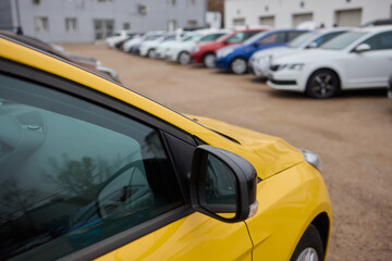 Car Sales and Loan Industry Concept. Row of Brand New Vehicles in Stock.