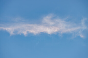 A beautiful sky tinted by the sun leaving vibrant shades of gold, pink, blue and multicolored. Clouds in the twilight evening and morning sky. Cloudy sky background in the evening, and during the day.