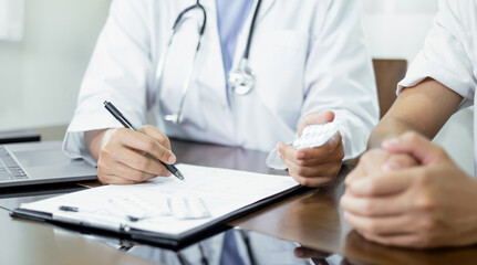 Female doctors who treat patients make an appointment to listen to the results after a physical...