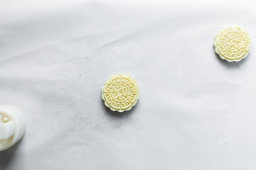 Overhead view of tuwon madara on white parchment paper, nigerian alawar madara milk candy, top view...