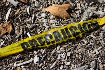 yellow spanish caution tape precaucion