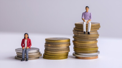 Income Inequality Depicted with Male and Female Figures on Coins