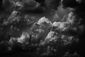 Black white dark grey sky with clouds. Dramatic background. Thunderstorm storm hurricane rain wind...