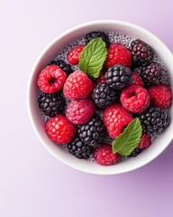 Chia Pudding with Fresh Raspberries and Blackberries in a White Bowl on a Pink Background - Healthy Dessert Option for Wellness and Nutrition Enthusiasts