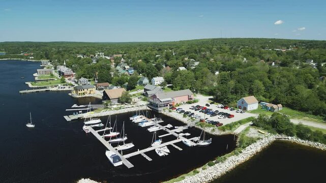 Aerial view of Atlantic Canada's historic Shelburne harbour waterfront, buildings, Yacht Club & Marina, Nova Scotia, Canada.  MAX QUAL PRORES422HQ Transcode of 4K H.265 D-CINELIKE original capture.