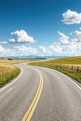 Fototapeta premium Winding Country Road Through Green Fields.