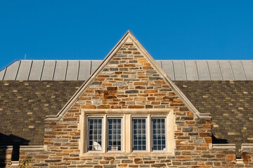 Ornate wall and windows. Collegiate gothic architecture style.