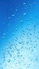 Blue water drops background with light reflecting off the droplets, creating a serene and refreshing image, reflecting, blue, shiny