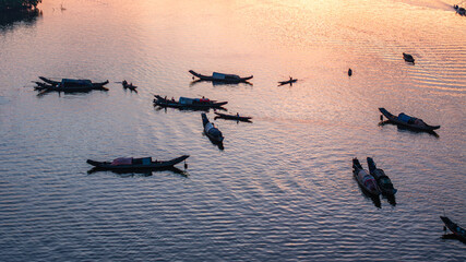 Dawn awakens and calms the fishing village in the lagoons of Hue.
