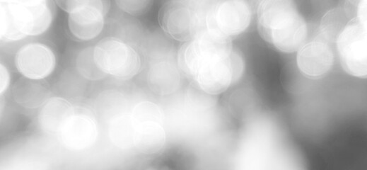 White, blurry, abstract background with circular bokeh lights. Premium bokeh photos with bright, elegant and clean colors, backgrounds for website banners and desktops.