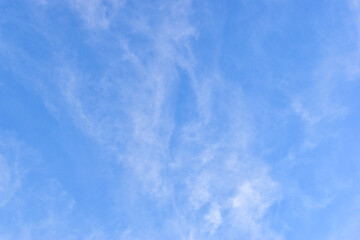 beautiful blue sky and white fluffy group of clouds with sunrise in the morning, natural background