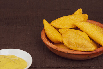 Delicious traditional Colombian empanadas with spicy sauce