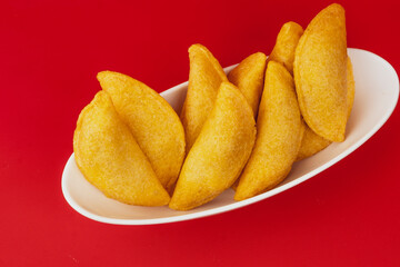 Delicious traditional Colombian empanadas with spicy sauce