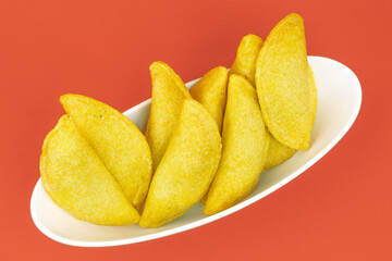 Colombian empanada with spicy sauce 
