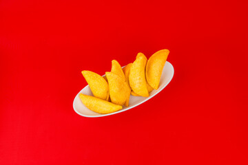 Colombian empanada with spicy sauce 
