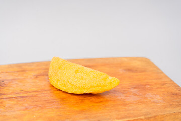 Colombian empanada with spicy sauce 